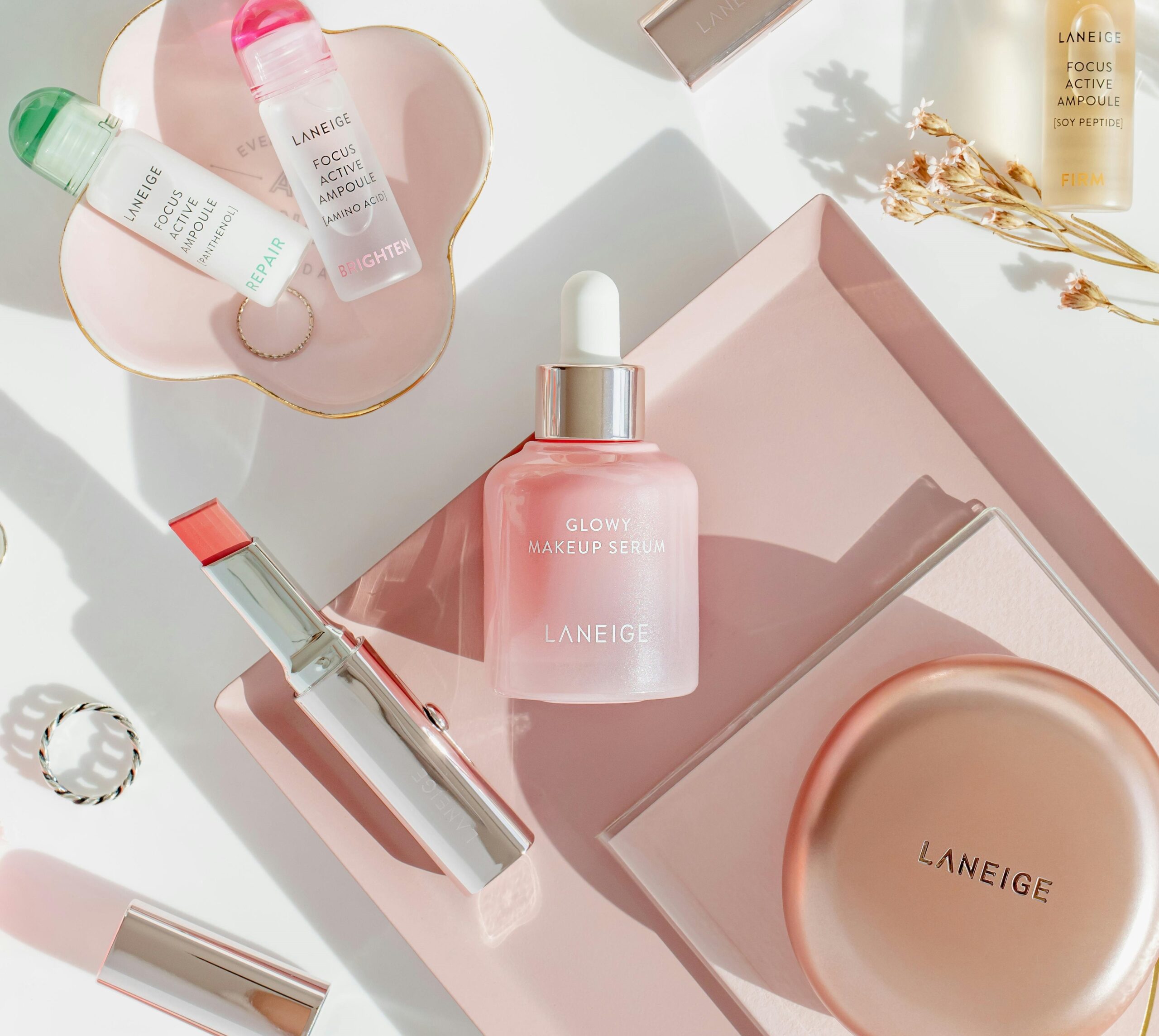image of beauty products lying on a sheet and clicked beautifully